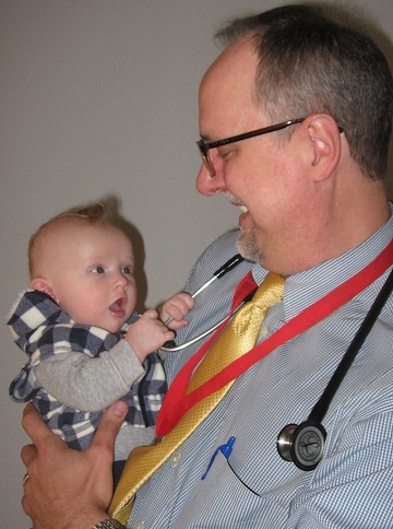 Scott Klewer, MD holding baby Spencer.