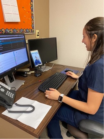 Cassandra Altamirano, a District Medical Group provider at Valleywise Health, conducts a virtual video visit with a patient.