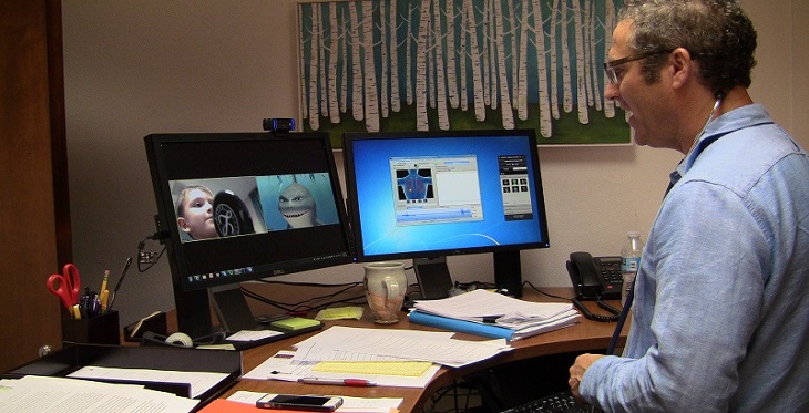 Dr. Conrad Clemens uses real-time video conferencing and digital stethoscope technology to evaluate a child's asthma.