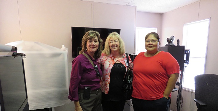 Dr. Waer (center) visiting Tuba Regional Medical Center’s telemedicine facility with Janet Major and Lynn Bedonie