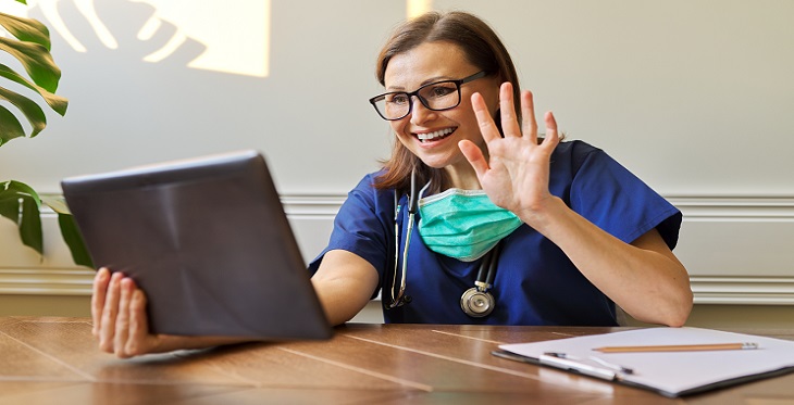 Depiction of doctor conducting telehealth video visit with patient
