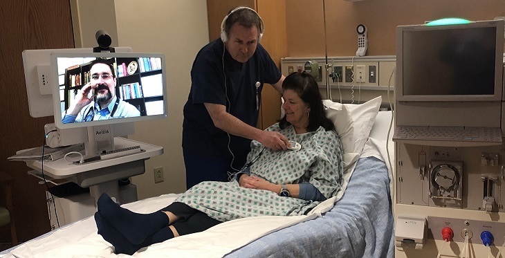 (L to R) Matthew Gembala, MD, of AKDHC demonstrates how a telenephrology consultation works with Troy Layden, RN, Summit dialysis manager, and Fredda Kermes, Summit telemedicine director.